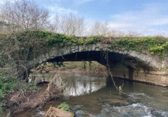 An old stone bridge over the River Tone