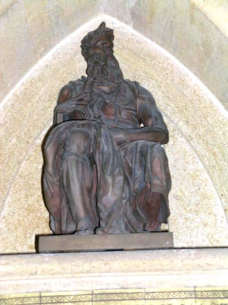 A bronze statue of Moses, seated. Unusually he is shown with horns.